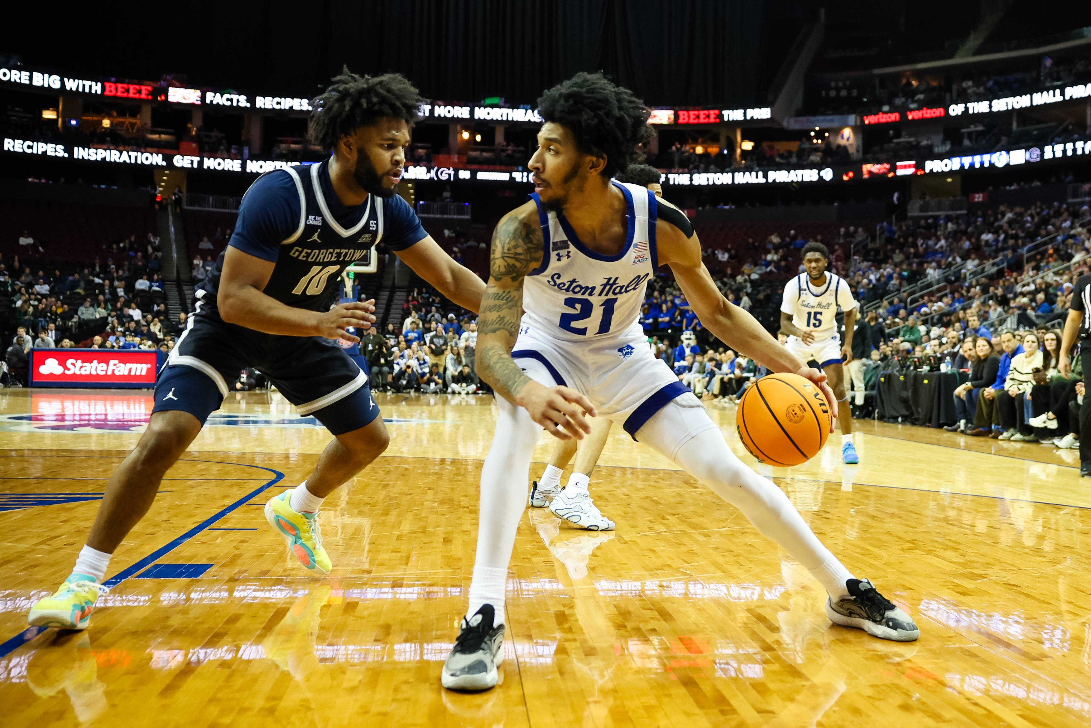 Isaiah Coleman (right) dribbles the ball against Jayden Epps (left) at the Prudential Center.