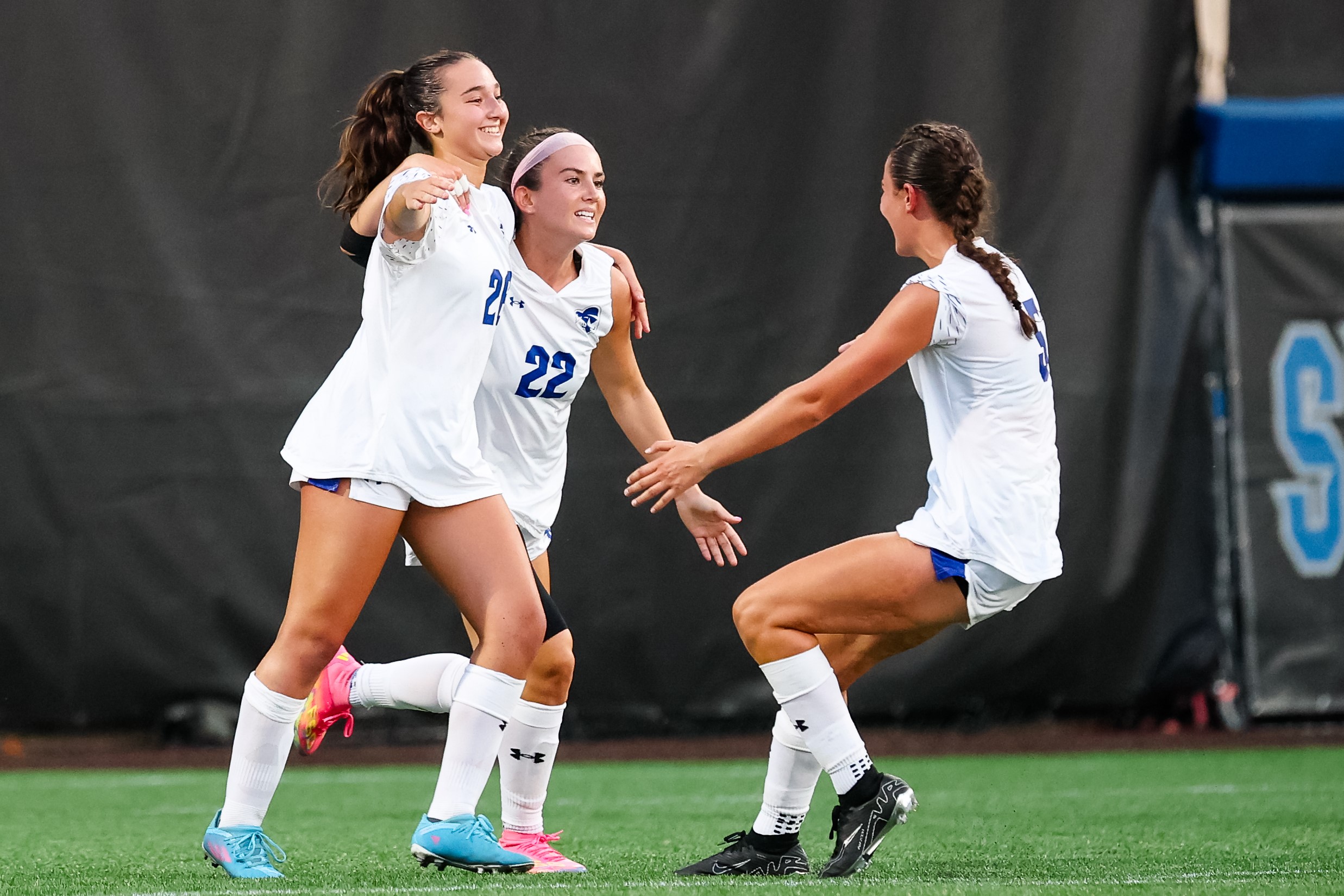 Nina Davis celebrating goal with Seton Hall teammates in Pirates' victory