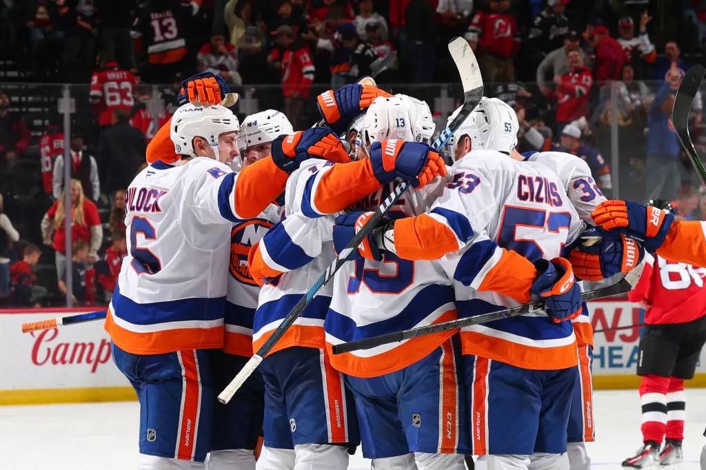 Islanders celebrate 4-3 overtime win over the Devils.