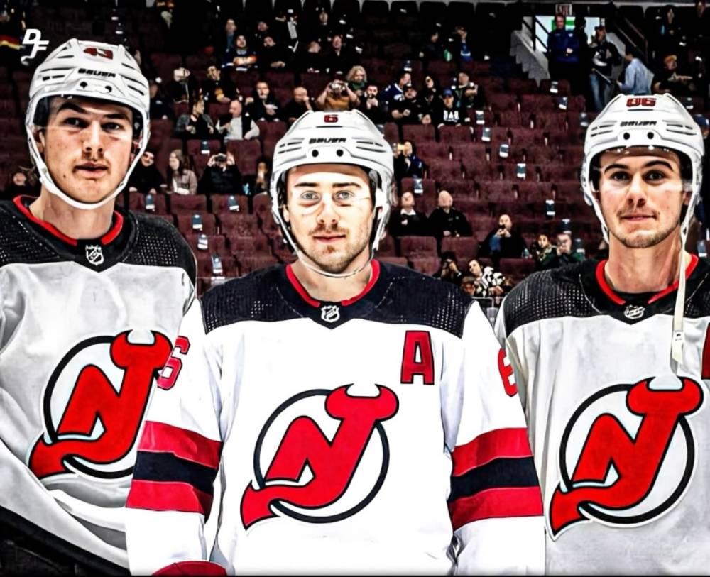 The Hughes brothers in Devils jerseys