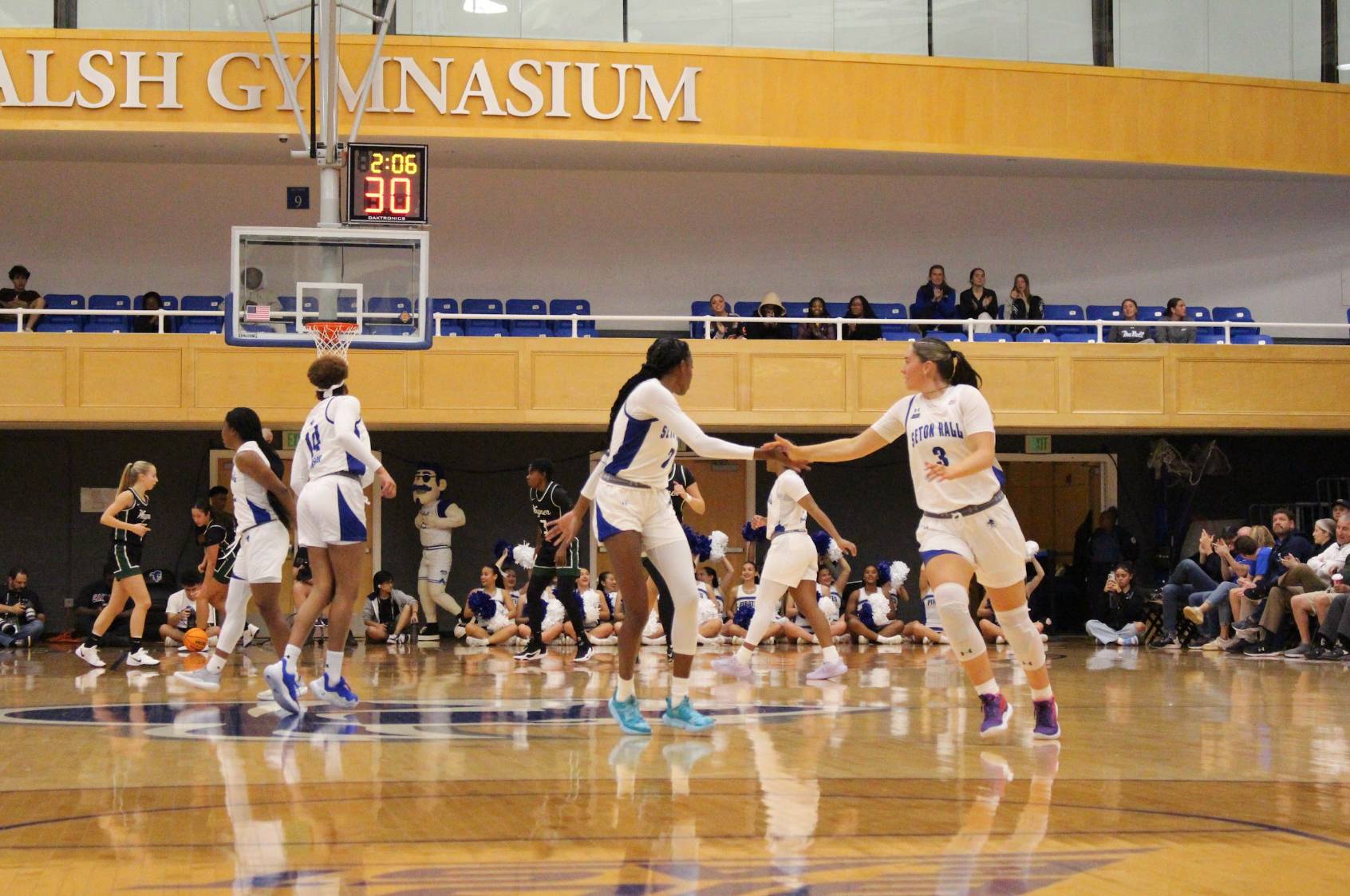 Yaya Lops and Faith Masonius High Five after a play