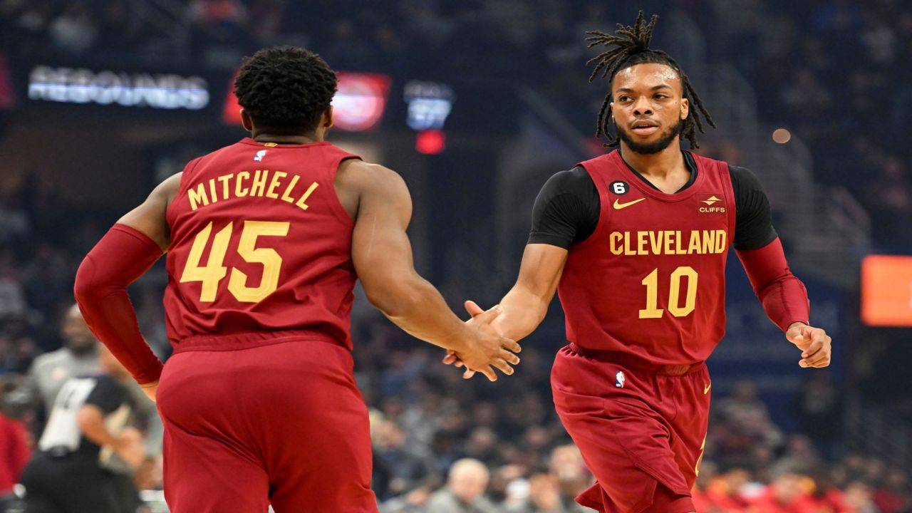 Cleveland Cavaliers guards Donovan Mitchell (45) and Darius Garland (10) celebrate a basket by Garland