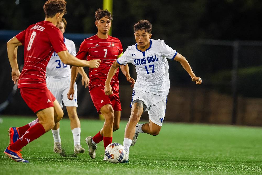 Seton Hall Midfielder Nico Rubio Battles For a Ball Against Multiple Defenders