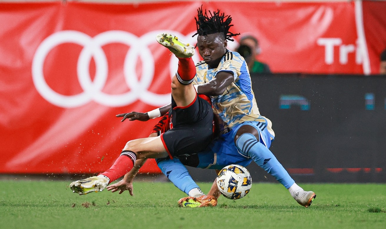 Philadelphia Union defender Olivier Mbaizo (15) battles New York Red Bulls defender John Tolkin (47) for the ball