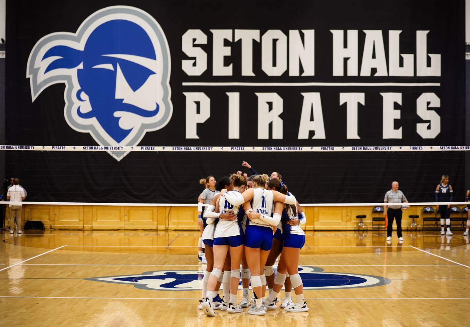 Volleyball team in their huddle