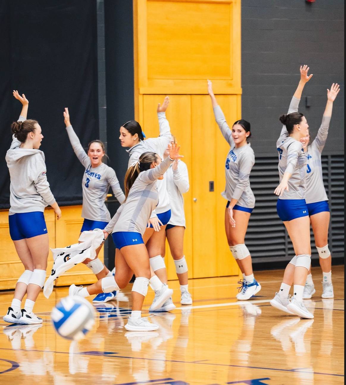 Seton Hall Volleyball's bench celebrates after a point