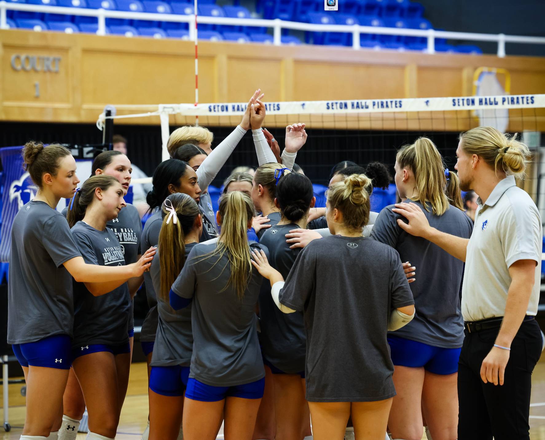 Seton Hall volleyball in a huddle