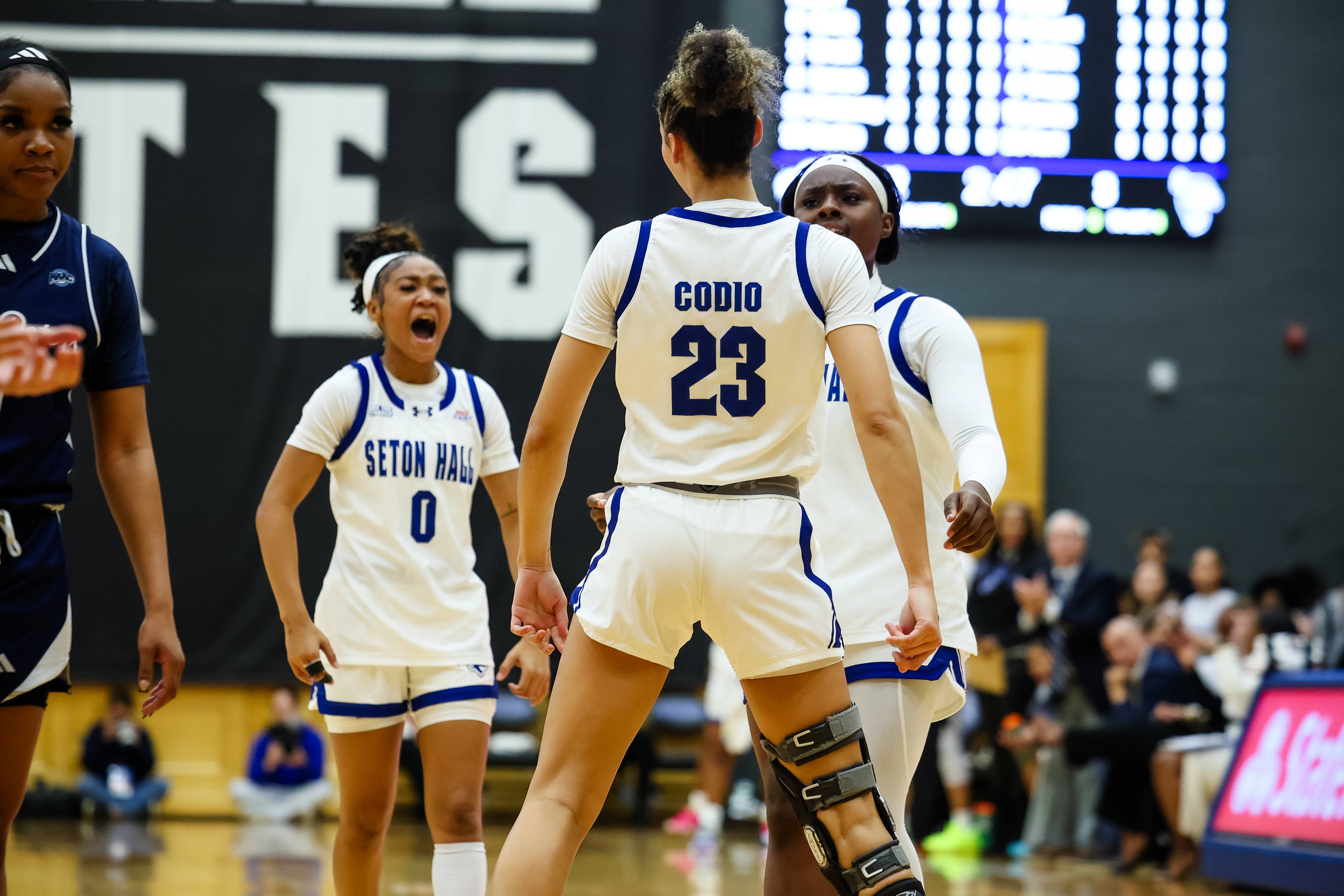 Jordana Codio, Jada Eads, Ja'Kahla Craft celebrate in win