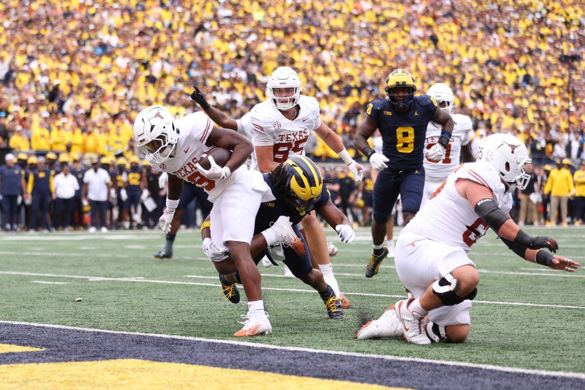 Texas Longhorns' Jerrick Gibson rushes for a touchdown against the Michigan Wolverines.