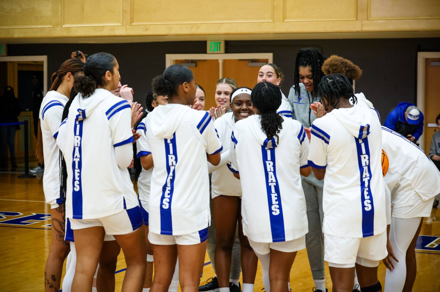 Women's basketball in huddle
